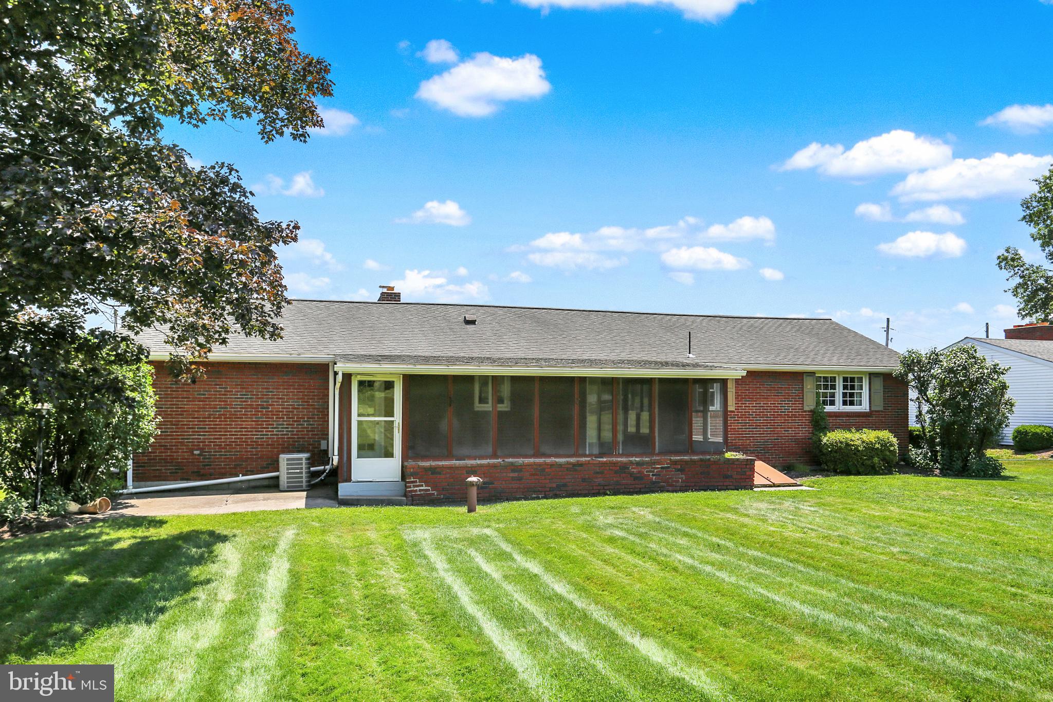 109 Ridgeview Drive Lewistown, PA 17044 - Photo 36 of 40 a front view of a house with a yard and garage