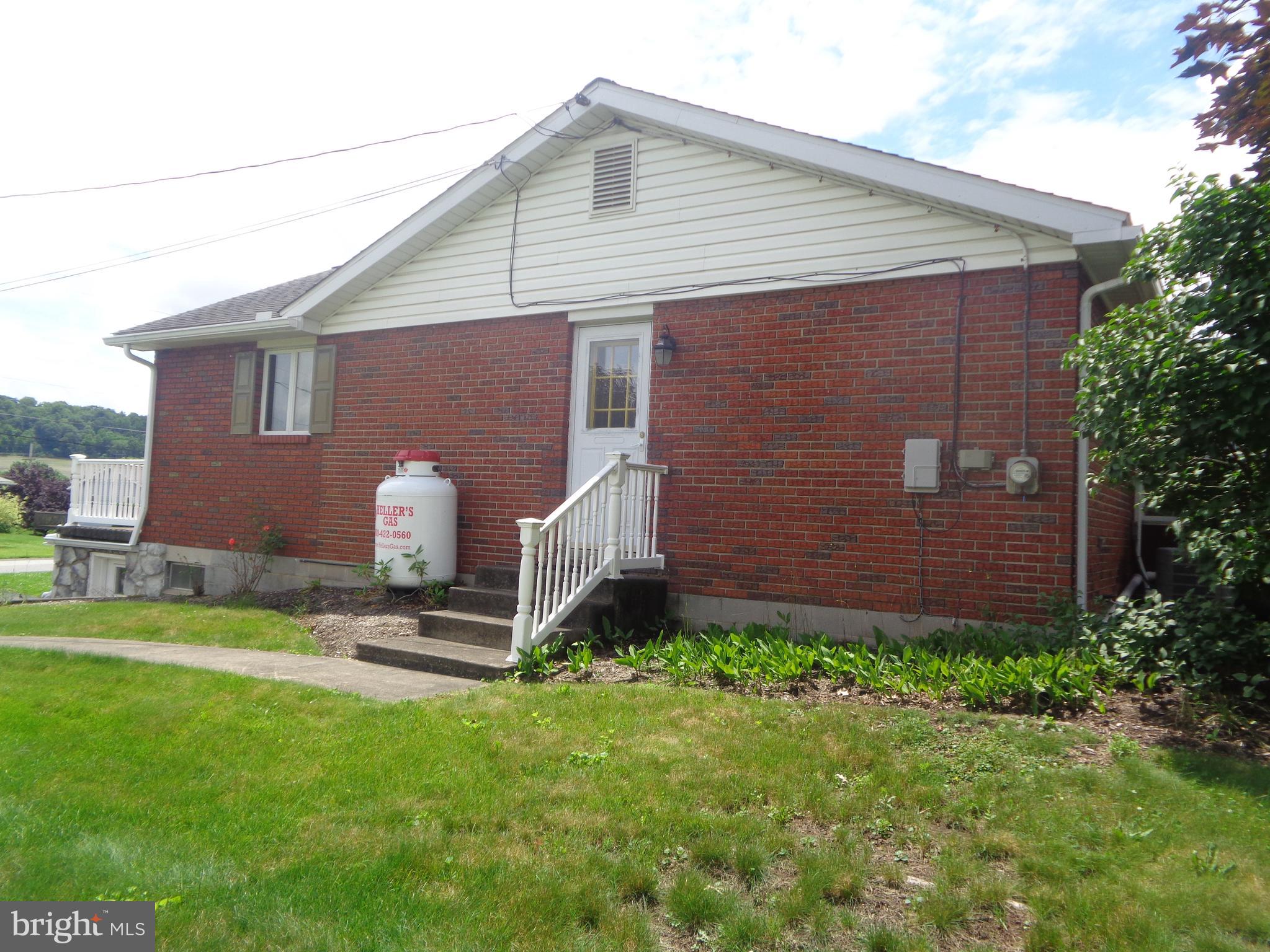 109 Ridgeview Drive Lewistown, PA 17044 - Photo 39 of 40 a front view of a house with garden