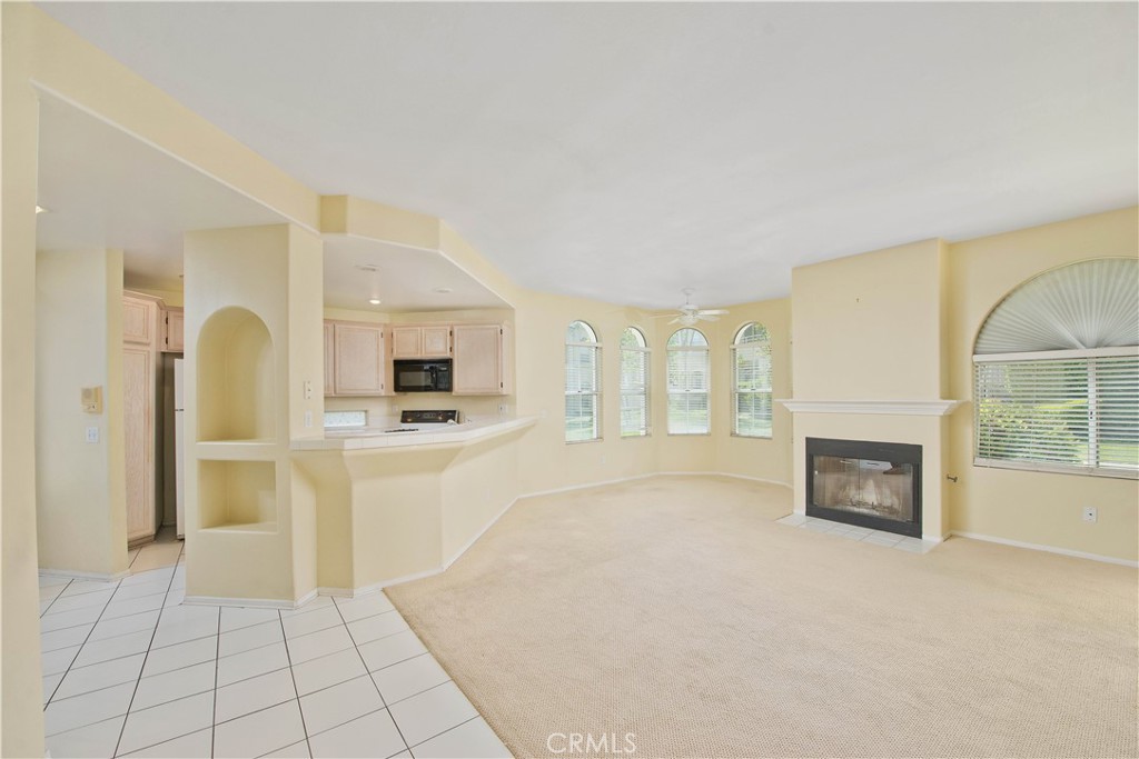 25554 Hemingway Avenue, Unit A Stevenson Ranch, CA 91381 - Photo 11 of 15 a view of a livingroom with a fireplace