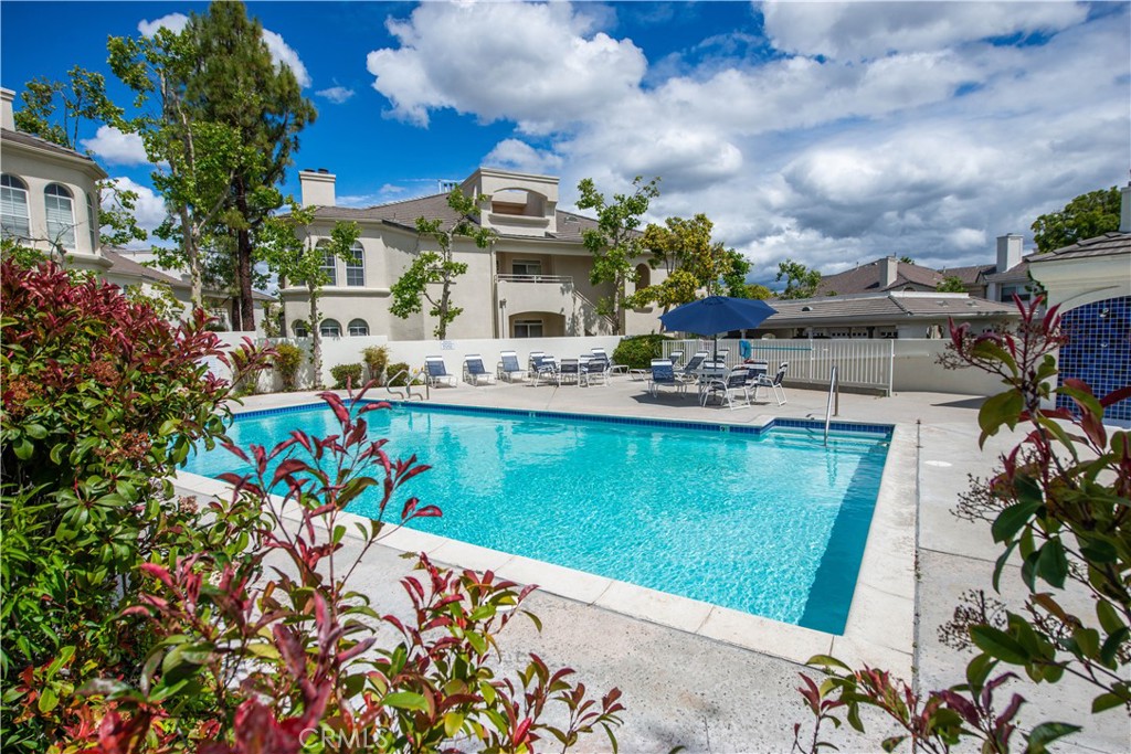 25554 Hemingway Avenue, Unit A Stevenson Ranch, CA 91381 - Photo 14 of 15 a view of a swimming pool with a yard