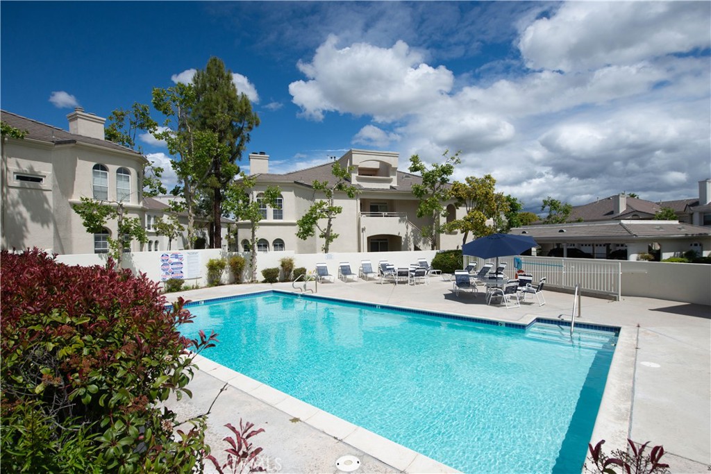 25554 Hemingway Avenue, Unit A Stevenson Ranch, CA 91381 - Photo 15 of 15 a view of a swimming pool with a patio