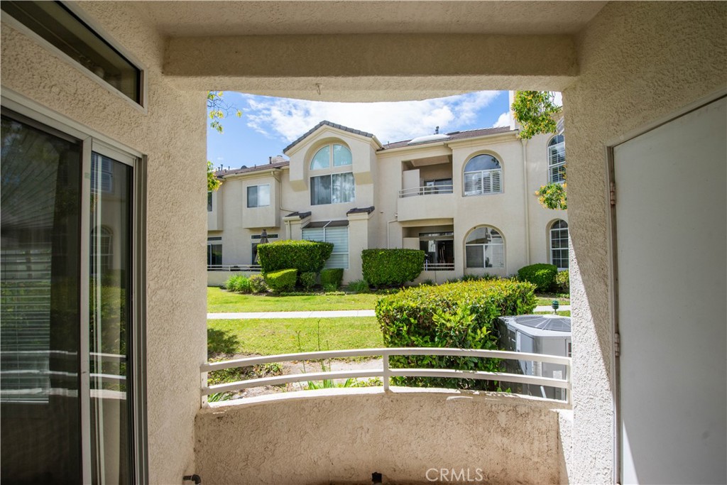 25554 Hemingway Avenue, Unit A Stevenson Ranch, CA 91381 - Photo 2 of 15 a front view of a house with a garden