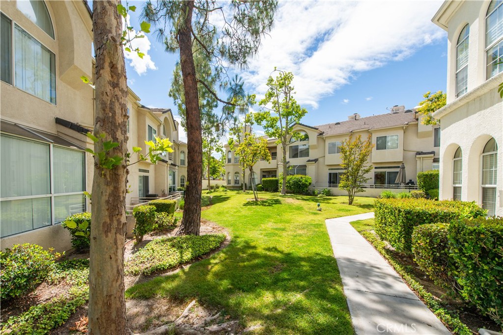 25554 Hemingway Avenue, Unit A Stevenson Ranch, CA 91381 - Photo 3 of 15 a swimming pool with outdoor seating and yard
