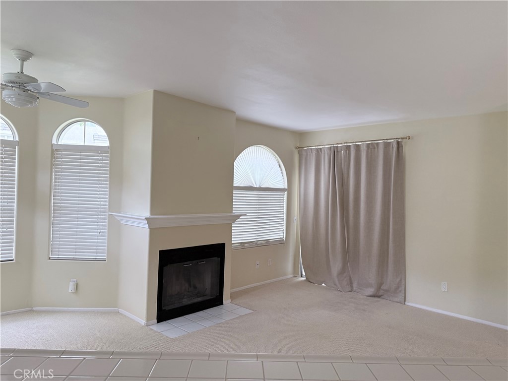 25554 Hemingway Avenue, Unit A Stevenson Ranch, CA 91381 - Photo 4 of 15 a view of a livingroom with an empty space and a fireplace