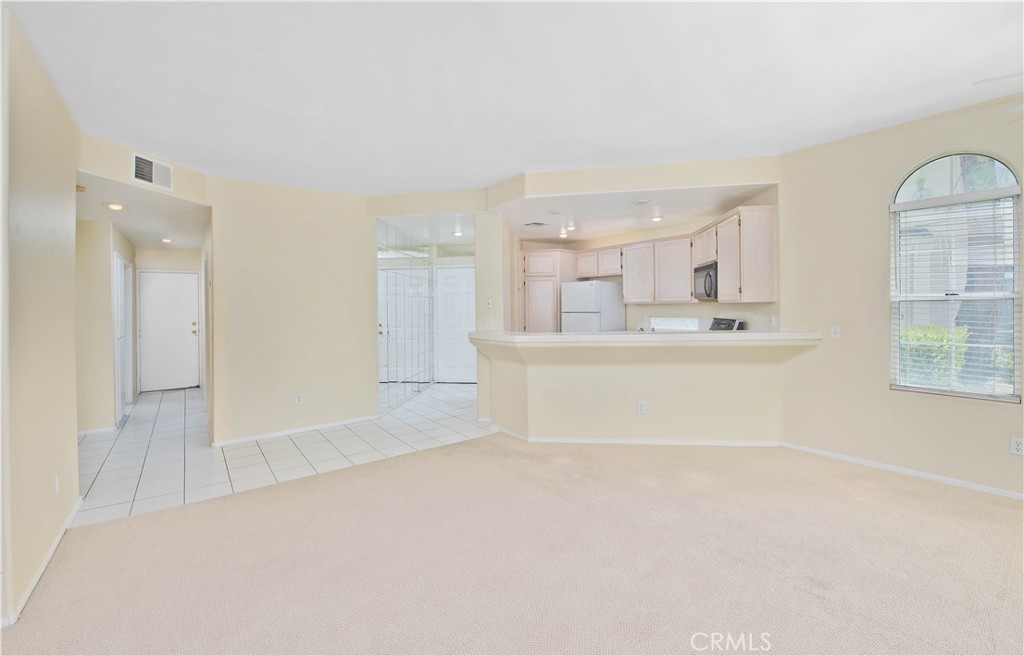 25554 Hemingway Avenue, Unit A Stevenson Ranch, CA 91381 - Photo 7 of 15 a view of a kitchen with kitchen island and stainless steel appliances