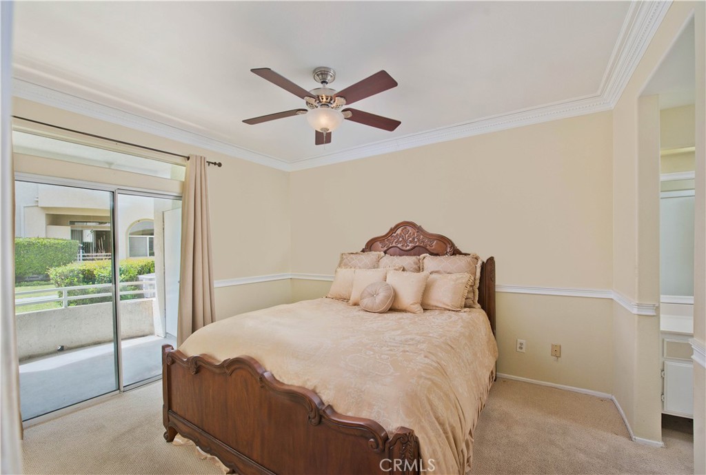 25554 Hemingway Avenue, Unit A Stevenson Ranch, CA 91381 - Photo 9 of 15 a bedroom with a bed and a painting on the wall