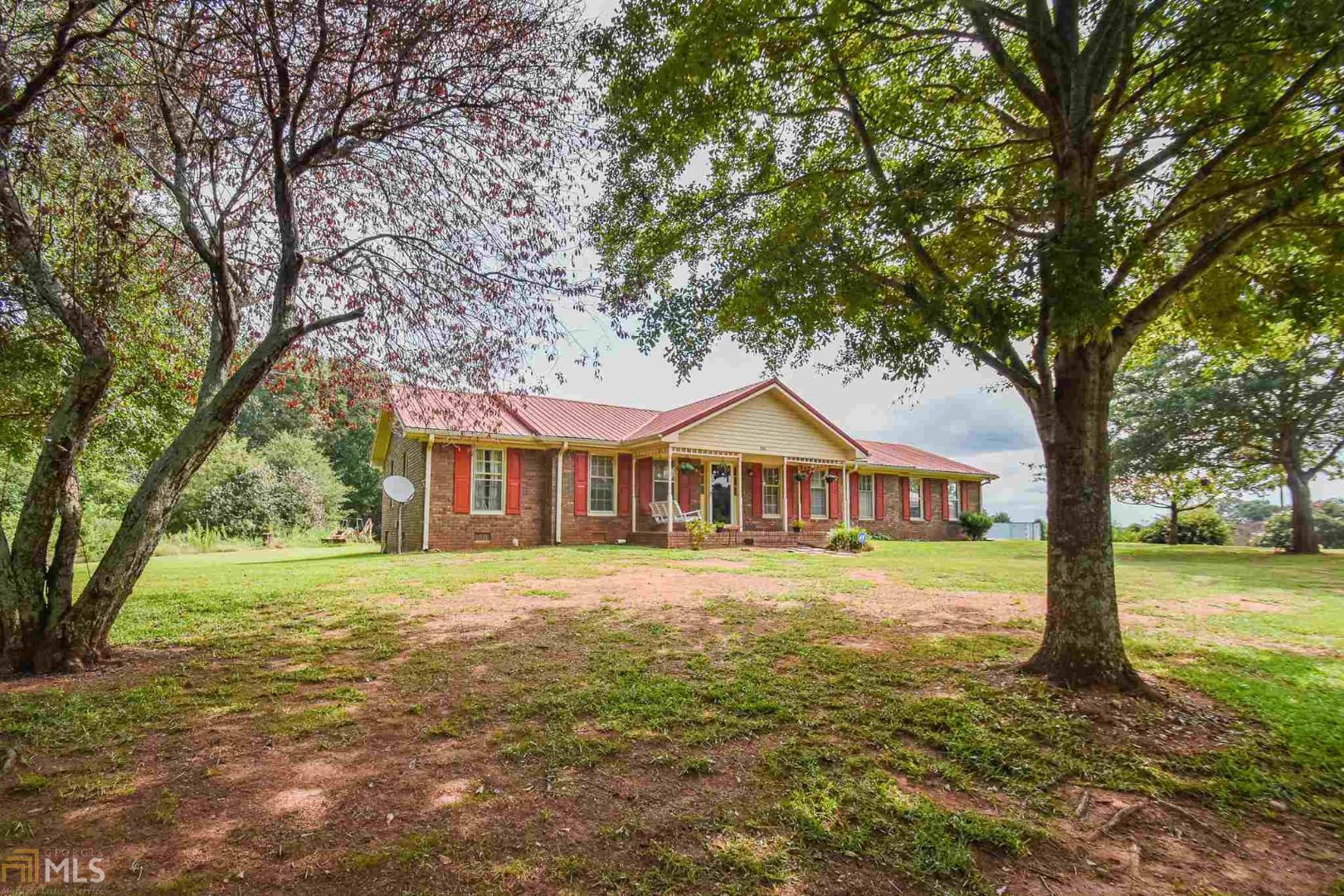 555 Ebenezer Church Road Jefferson, GA 30549 - Photo 1 of 1 a front view of a house with a yard