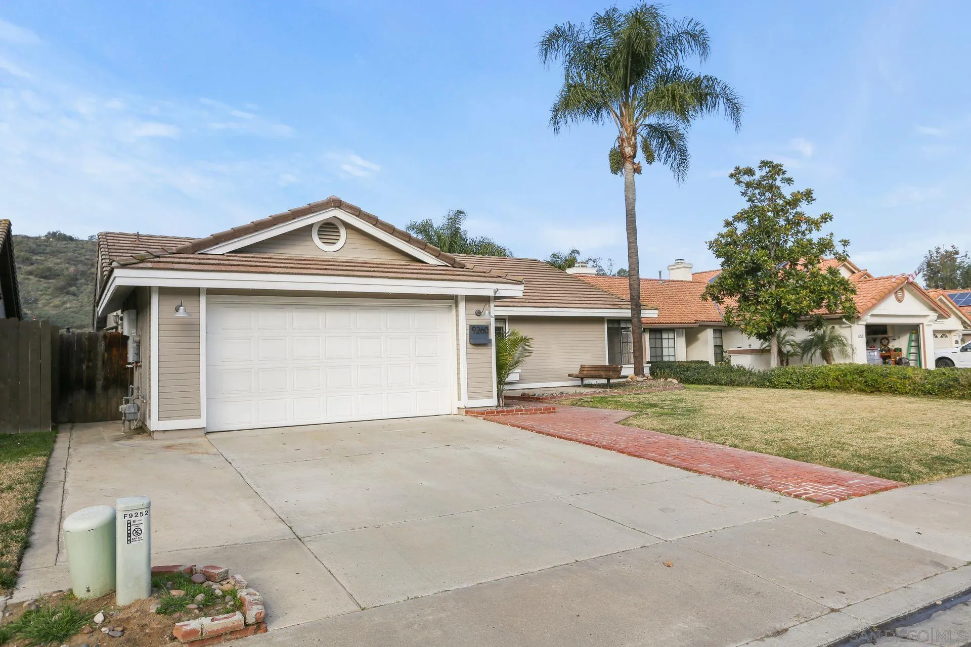9260 Sombria Road Lakeside, CA 92040 - Photo 1 of 31 front view of a house with a street