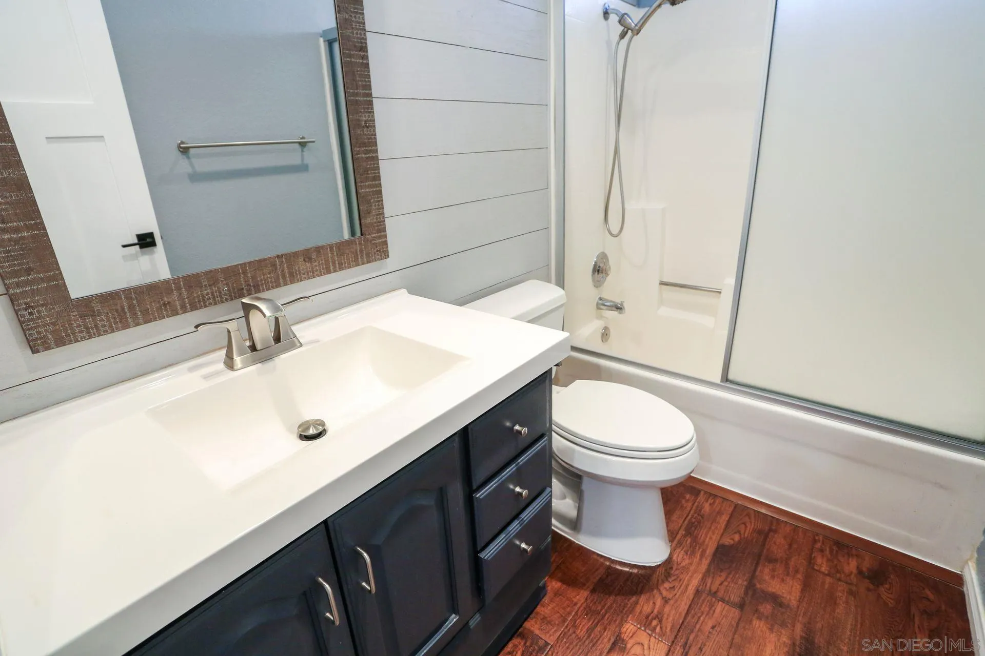 9260 Sombria Road Lakeside, CA 92040 - Photo 19 of 31 a bathroom with a sink a toilet and shower