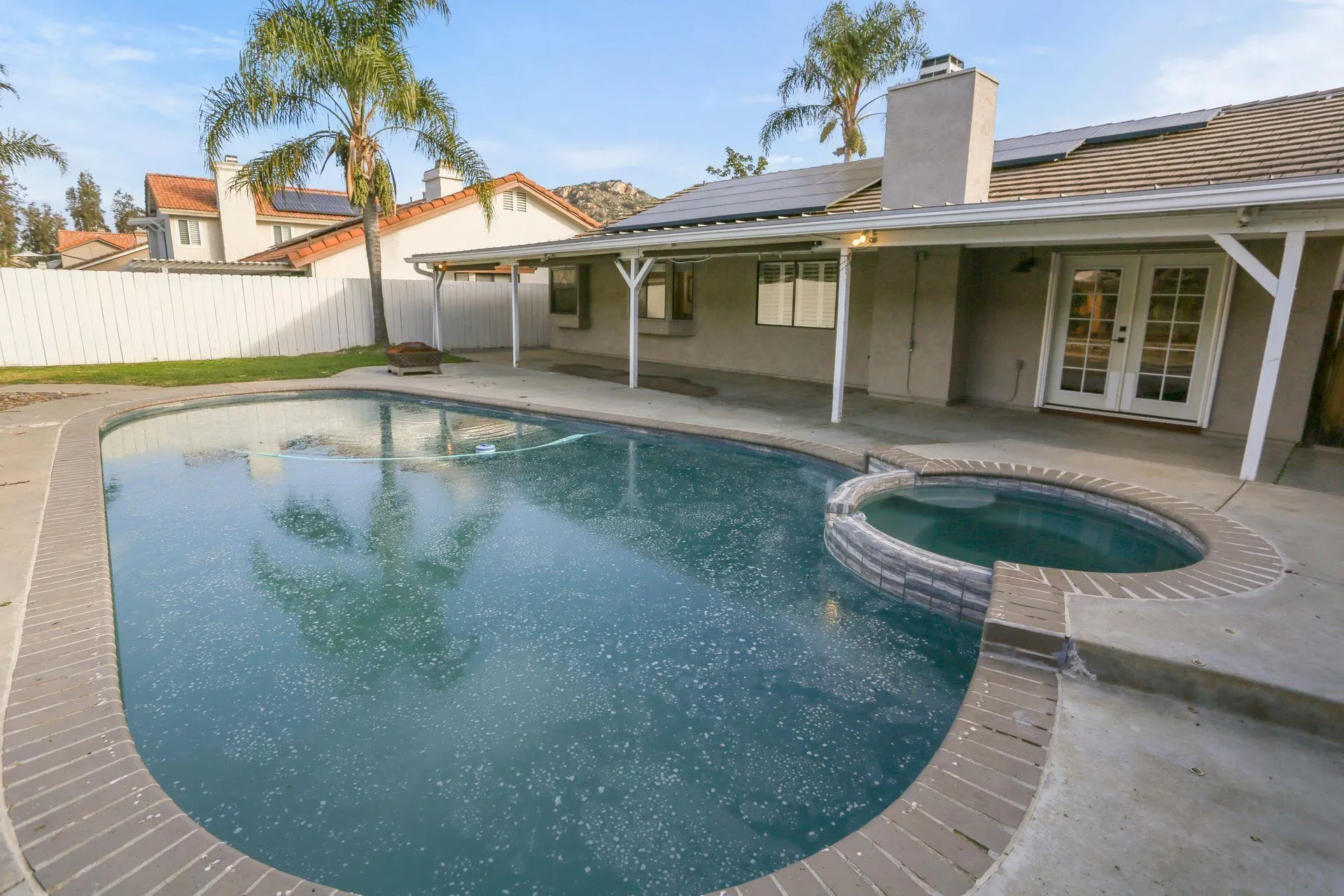 9260 Sombria Road Lakeside, CA 92040 - Photo 29 of 31 a view of a house with pool fire pit and chair