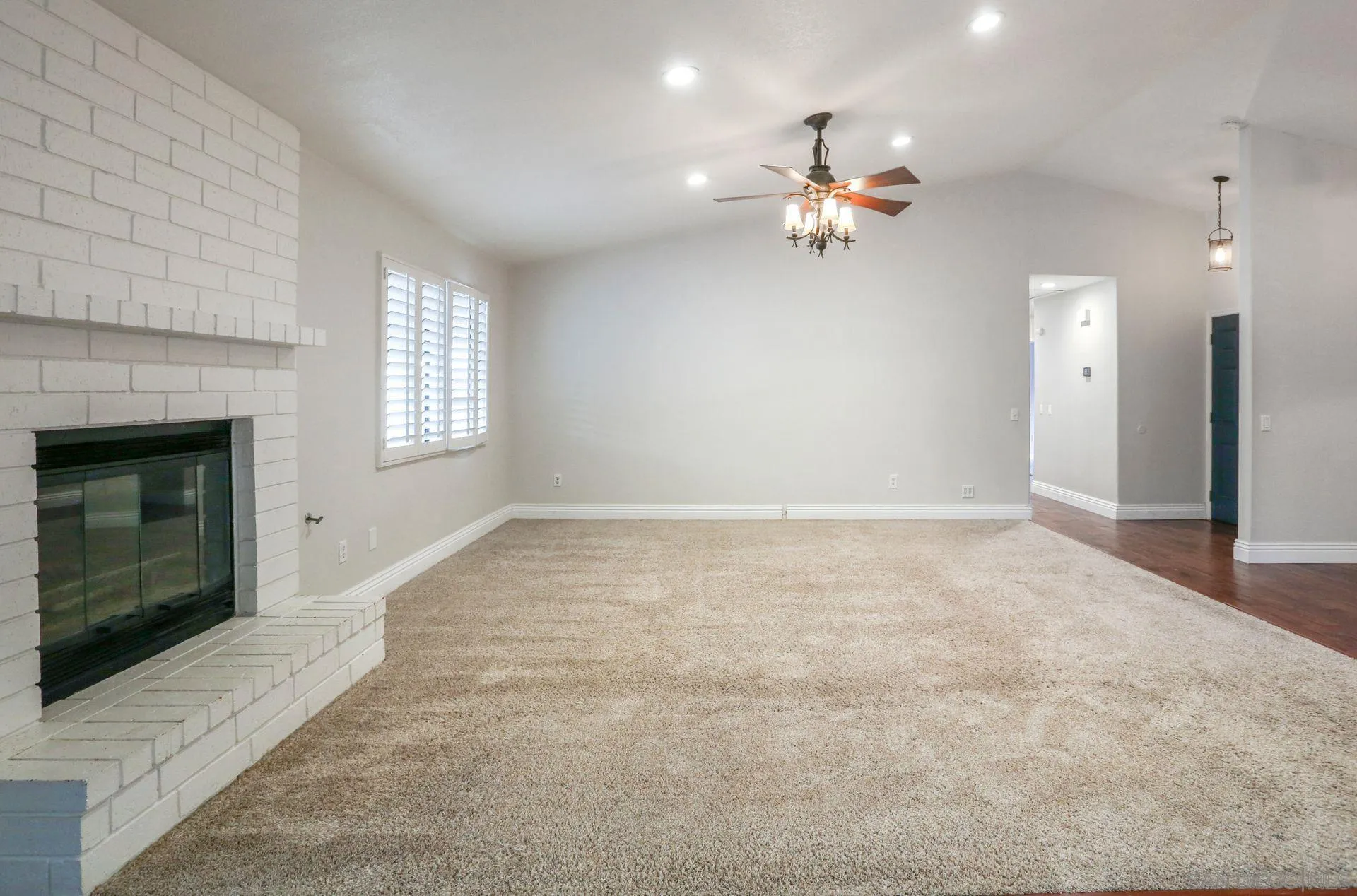 9260 Sombria Road Lakeside, CA 92040 - Photo 8 of 31 an empty room with windows and fireplace