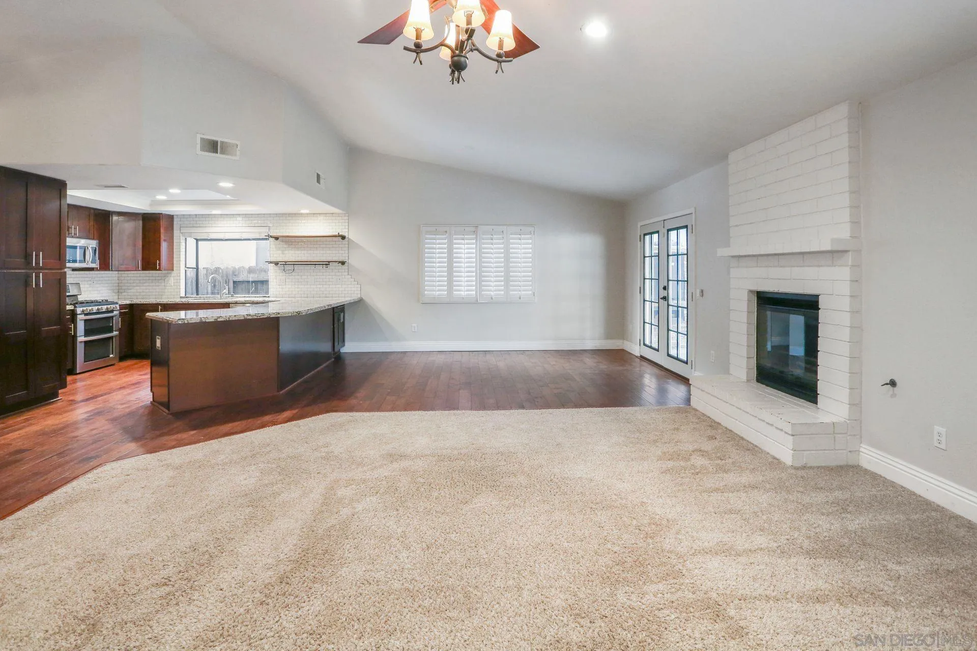 9260 Sombria Road Lakeside, CA 92040 - Photo 9 of 31 an empty room with kitchen and fireplace