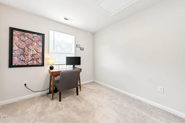 a workspace with furniture and a window