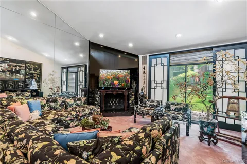 a living room with lots of furniture and a wooden floor