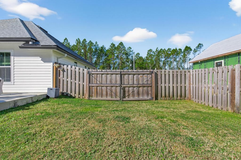 75774 Edwards Road Yulee, FL 32097 - Photo 54 of 70 a view of a backyard of the house