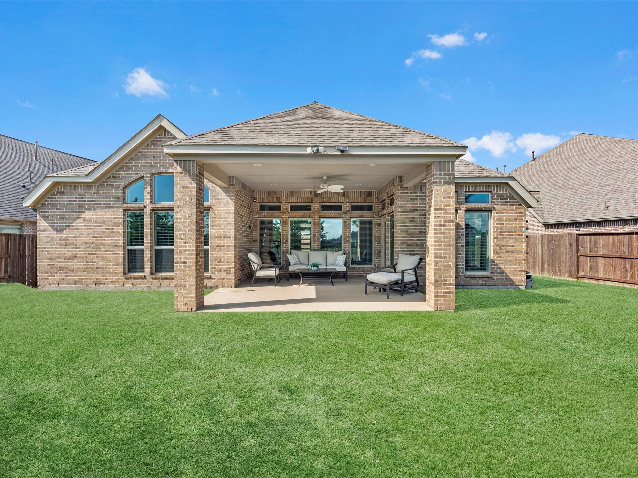 10135 Napier Drive Rosharon, TX 77583 - Photo 28 of 36 Enjoy evenings outdoors under the covered patio, complete with a gas line—perfect for a future outdoor kitchen—as well as electrical outlets for added convenience.