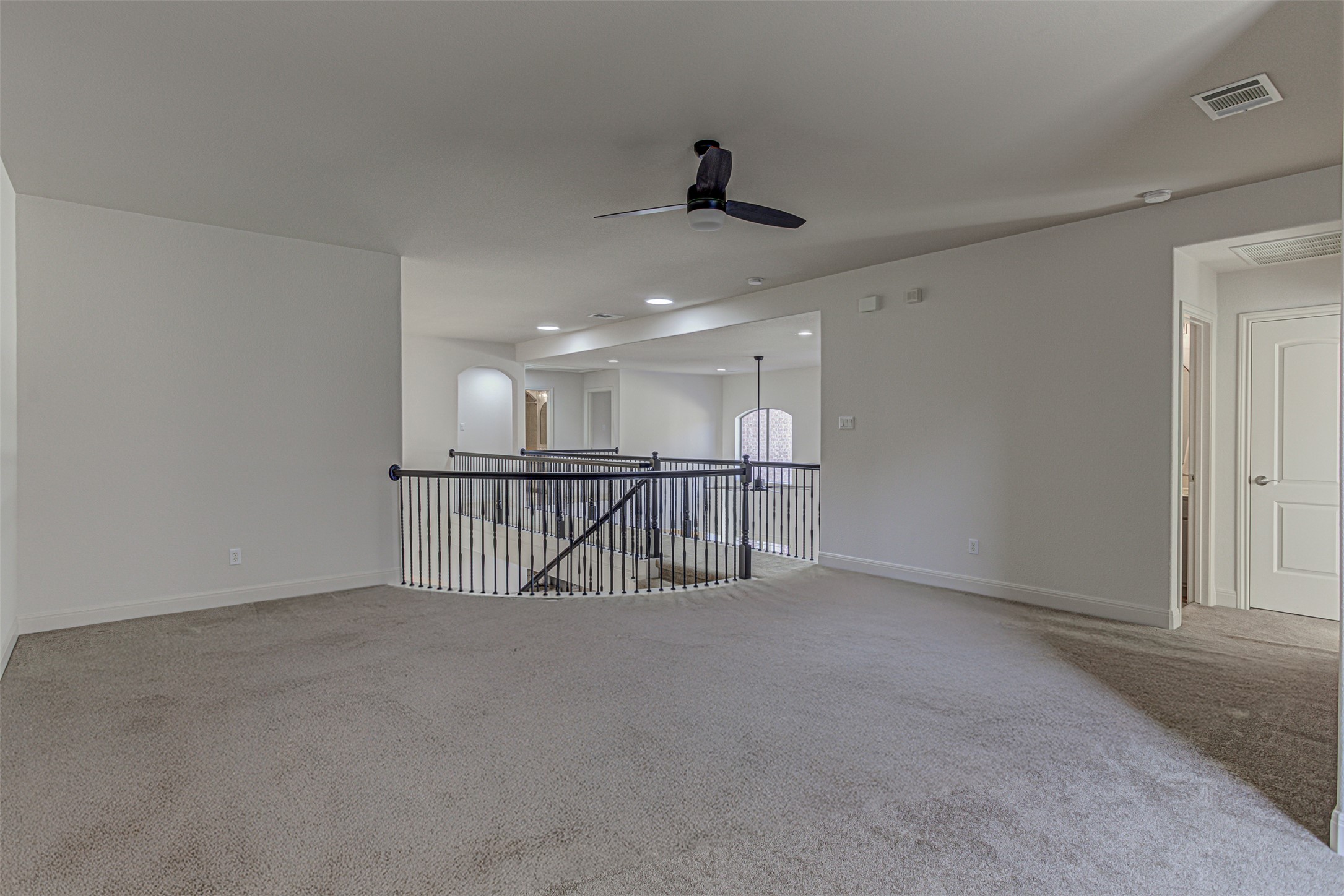 110 Sebastians Run Austin, TX 78738 - Photo 25 of 40 Room featuring light carpet, ceiling fan, and recessed lighting