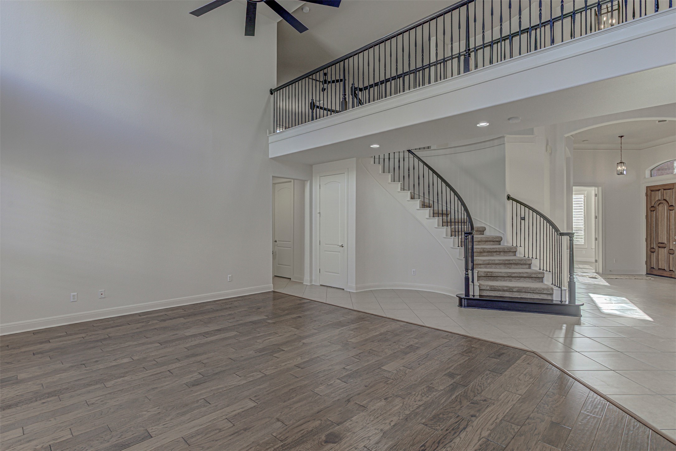 110 Sebastians Run Austin, TX 78738 - Photo 3 of 40 Large open living room with iron/wppd railings with high ceilings l