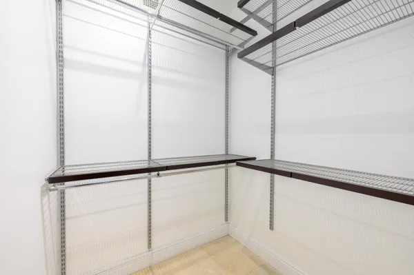 a view of an empty walk in closet