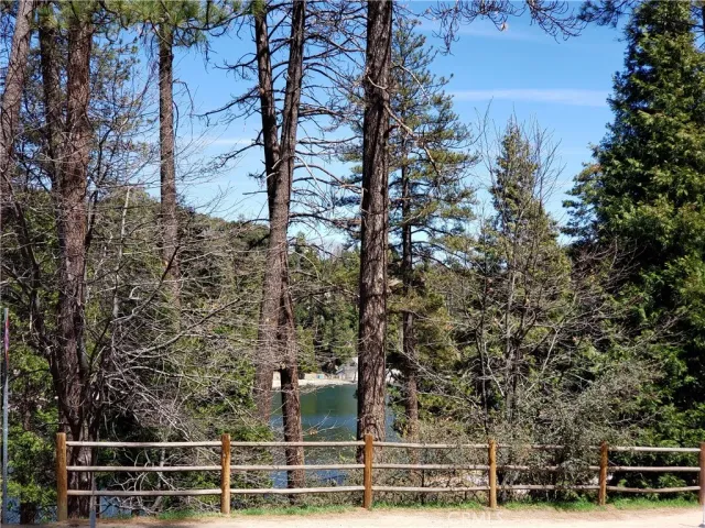 a view of a street with a building in the background