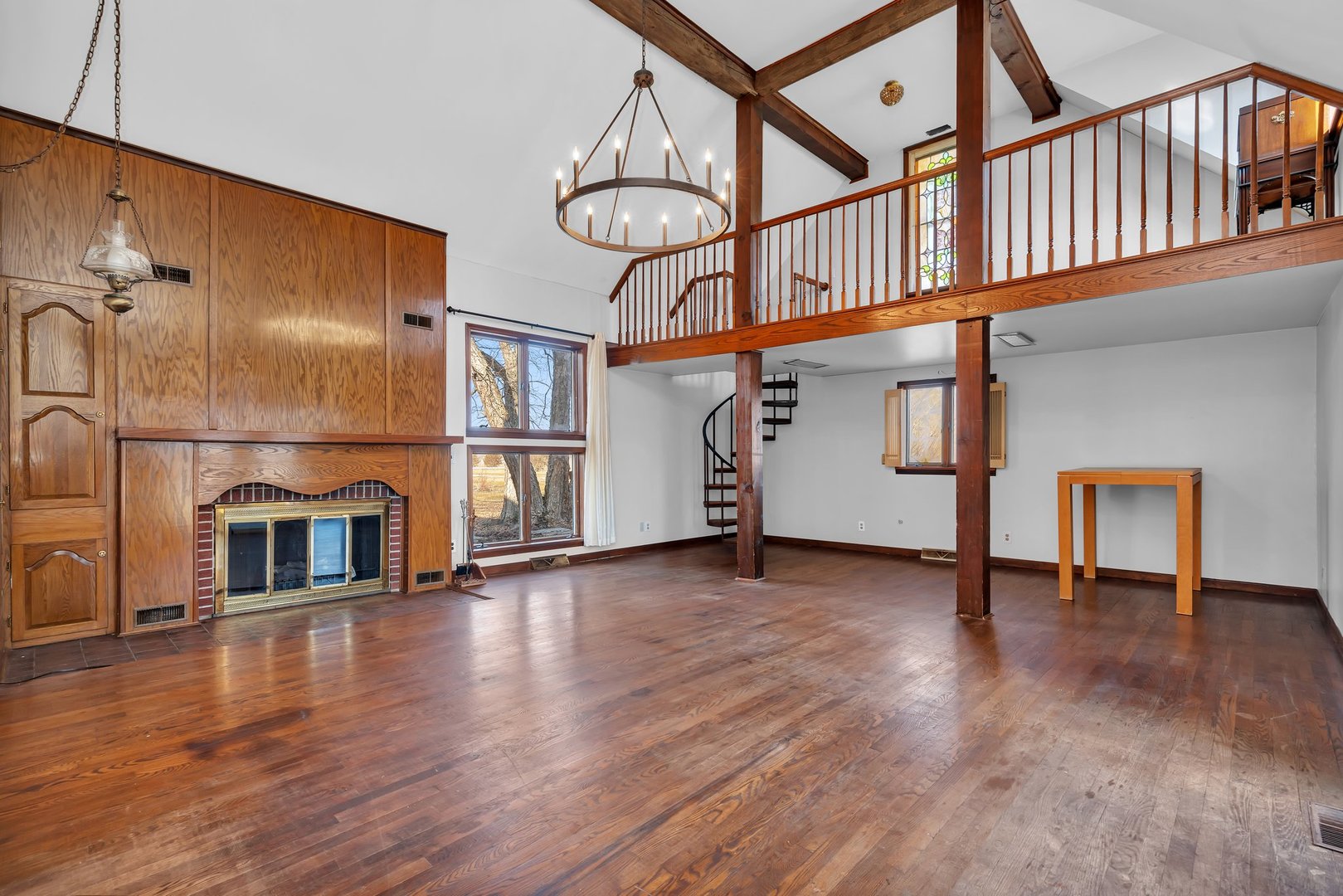 13070 McKanna Road Minooka, IL 60447 - Photo 12 of 43 a view of an empty room with wooden floor and a window