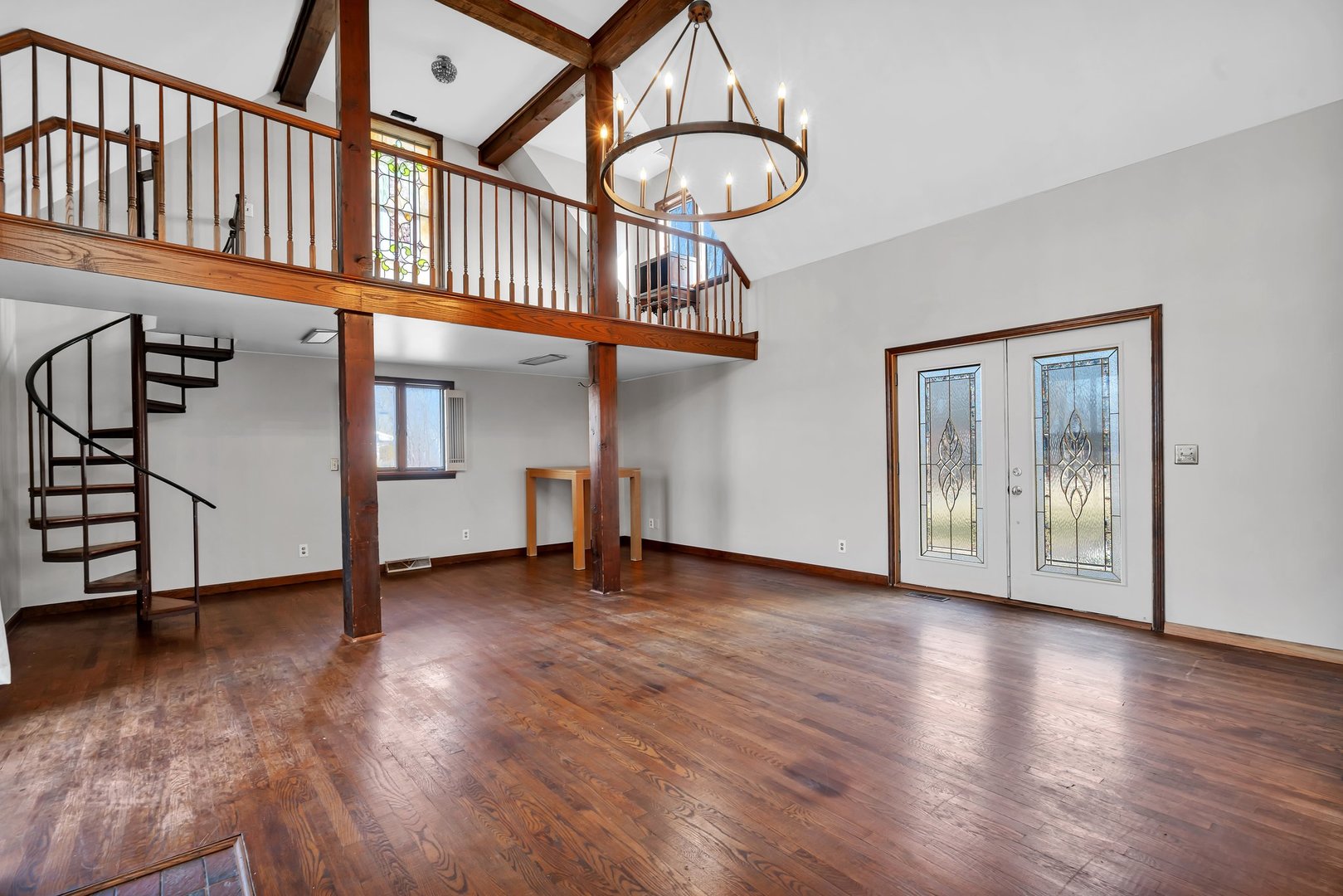 13070 McKanna Road Minooka, IL 60447 - Photo 14 of 43 an empty room with wooden floor and windows