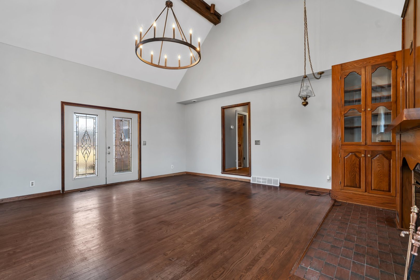 13070 McKanna Road Minooka, IL 60447 - Photo 16 of 43 a view of an empty room with wooden floor and a window