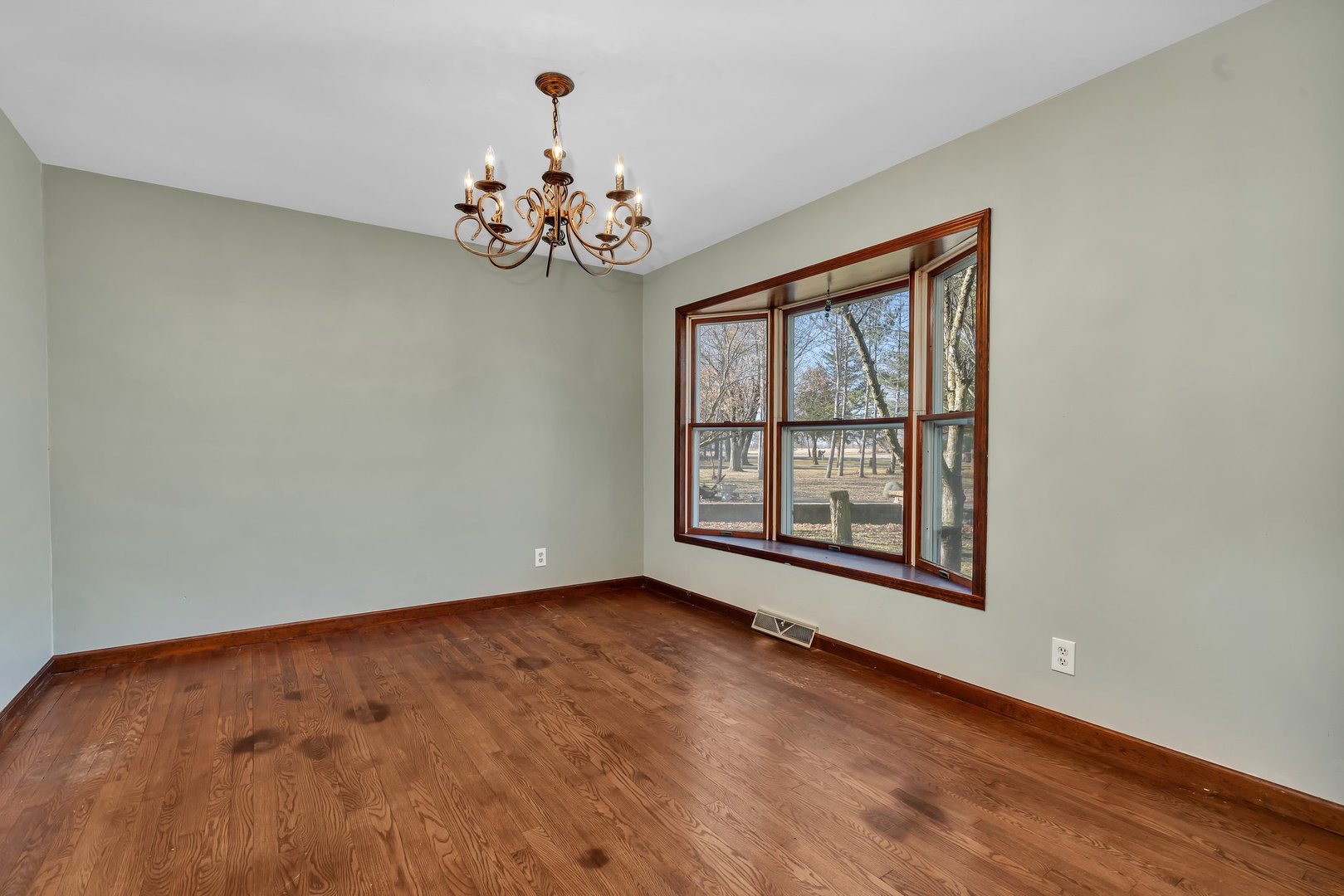 13070 McKanna Road Minooka, IL 60447 - Photo 20 of 43 an empty room with windows and chandelier