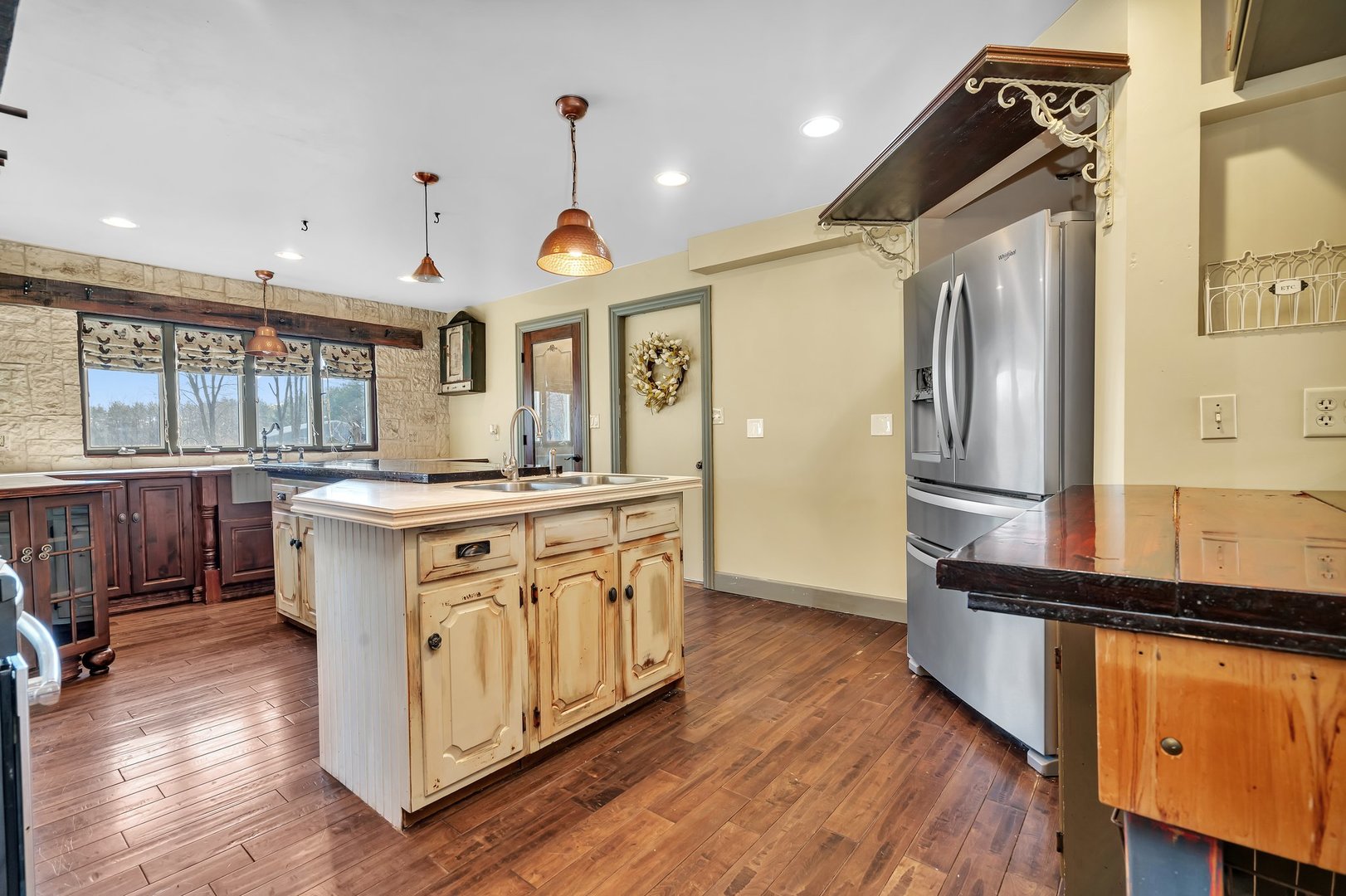13070 McKanna Road Minooka, IL 60447 - Photo 21 of 43 a kitchen with stainless steel appliances granite countertop a sink a stove and a wooden floors