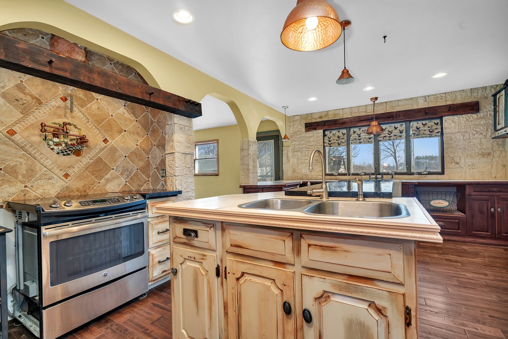 13070 McKanna Road Minooka, IL 60447 - Photo 22 of 43 a kitchen with a stove and a sink