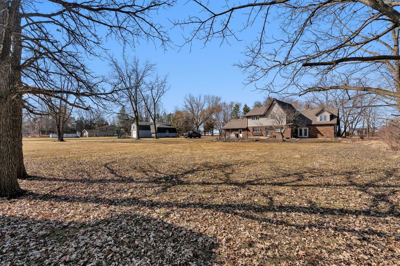 13070 McKanna Road Minooka, IL 60447 - Photo 40 of 43 a view of dirt yard with a large tree