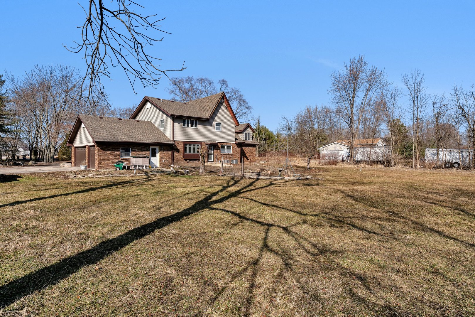 13070 McKanna Road Minooka, IL 60447 - Photo 43 of 43 a view of patio with a table and chairs under an umbrella