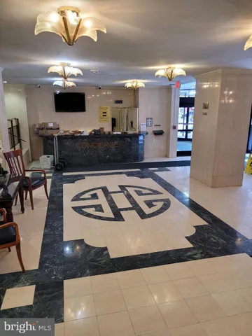 a kitchen with kitchen island granite countertop a sink cabinets and a stove