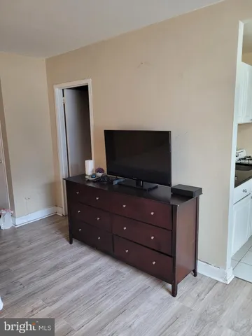 a bathroom with a sink vanity tub and a mirror