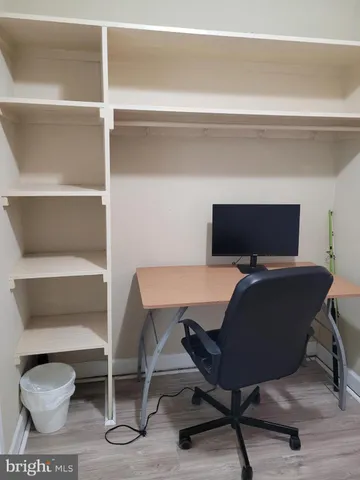a bathroom with a toilet a sink and a mirror