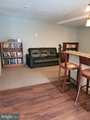 a bathroom with a granite countertop sink and a window