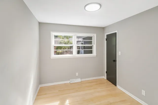 a view of an empty room with a window