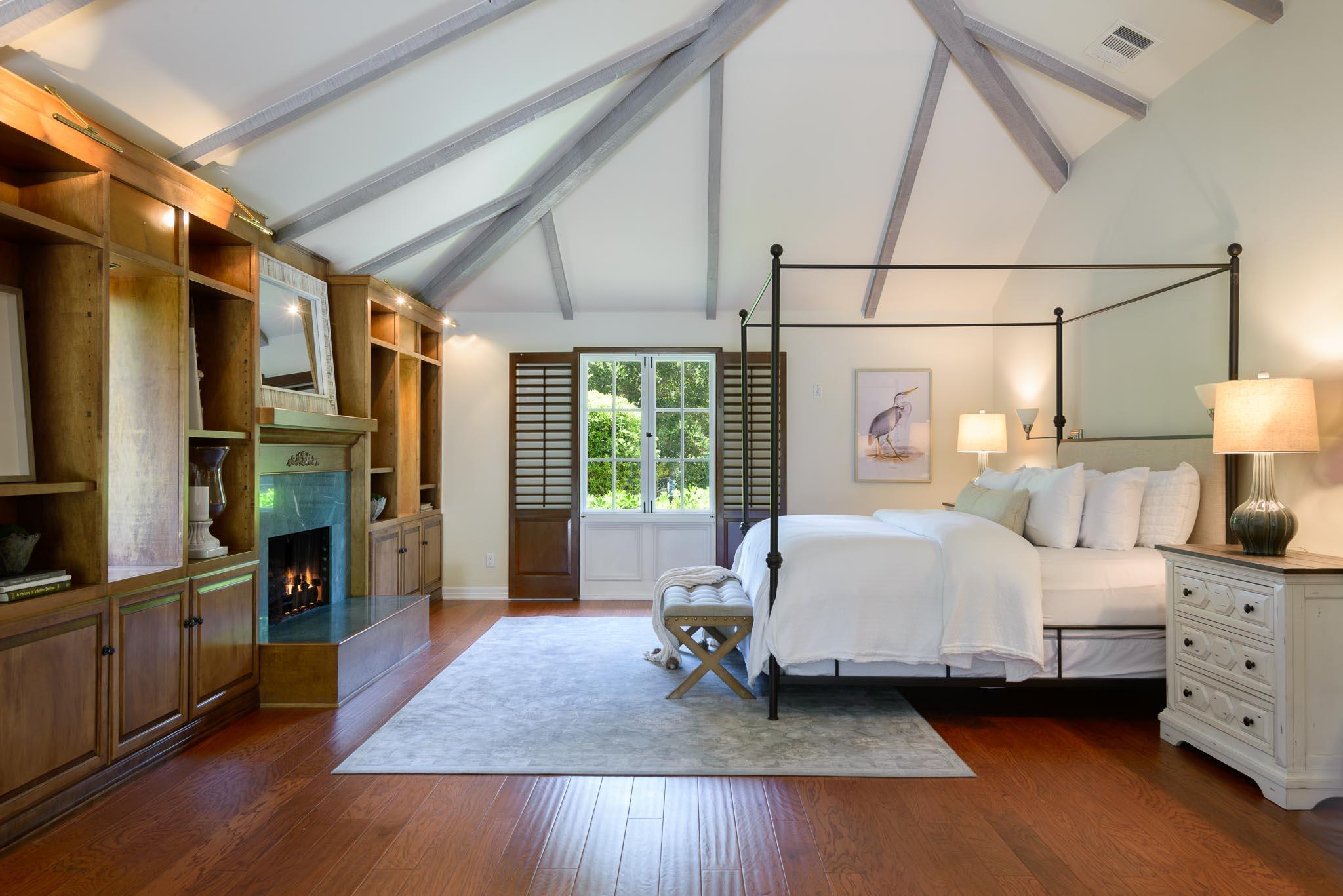 720 El Bosque Road Santa Barbara, CA 93108 - Photo 11 of 21 a spacious bedroom with a bed and wooden floor