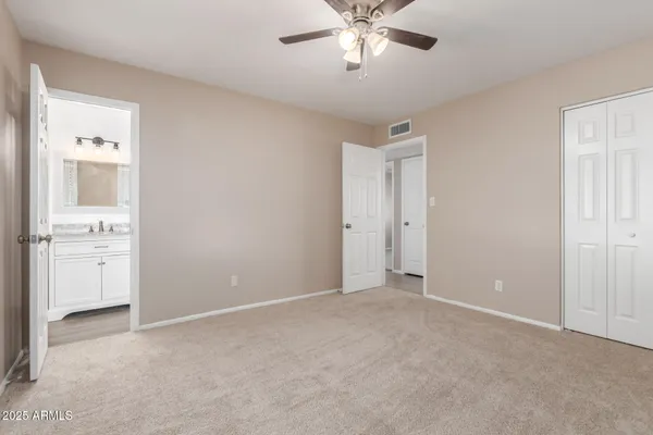 a view of an empty room with a bathroom