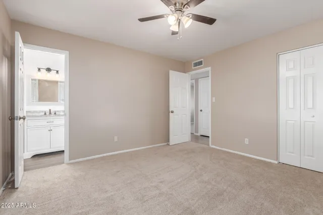 a view of an empty room with a bathroom