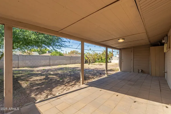 a view of a backyard of the house