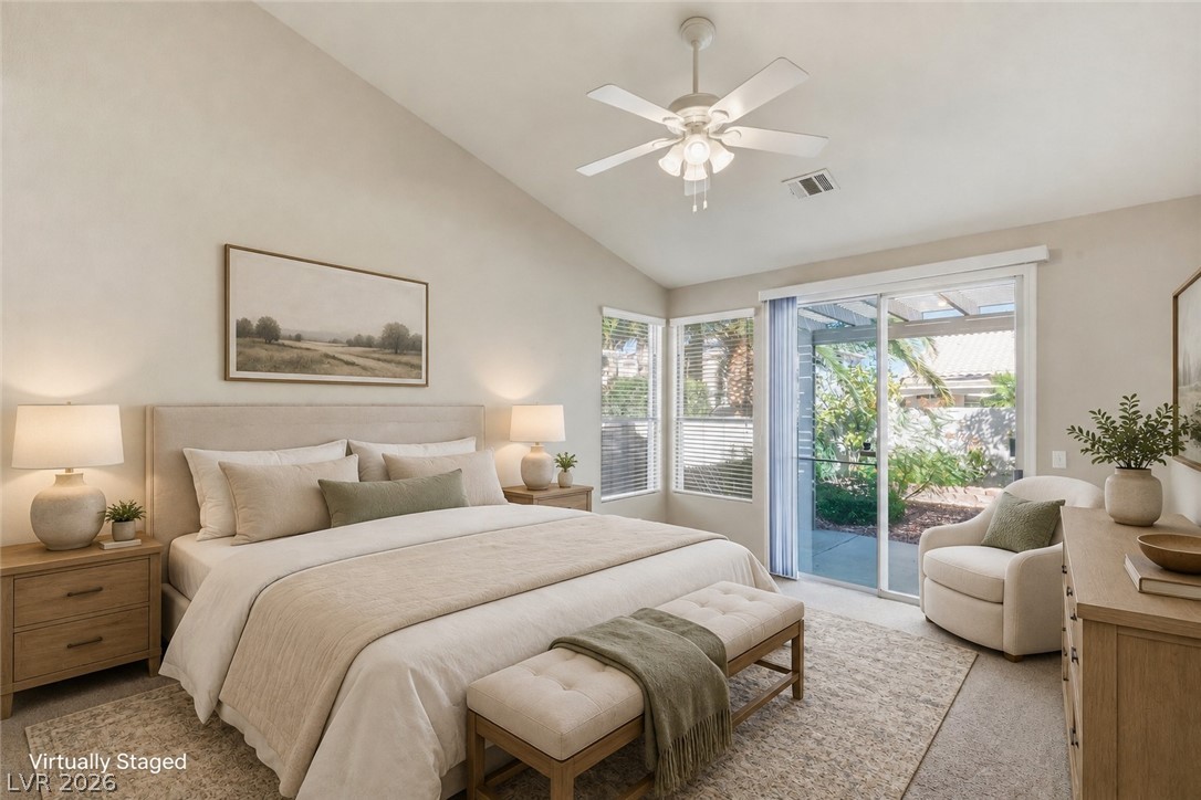Vaulted ceilings and sliding glass doors defining a serene bedroom layout.