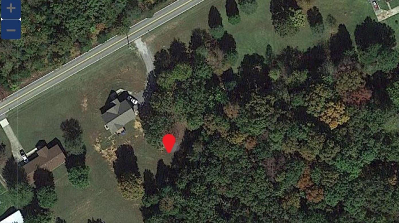 5189 Marion Road Cunningham, TN 37052 - Photo 6 of 7 an aerial view of residential house with outdoor space and trees all around