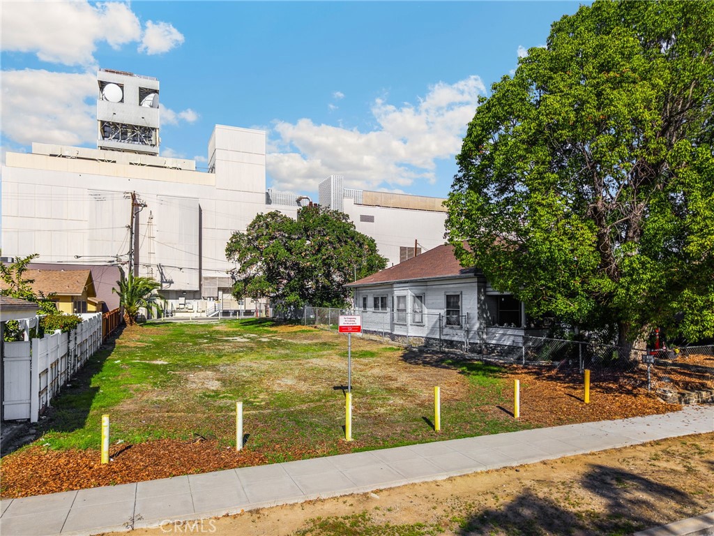 220 West C Street Ontario, CA 91762 - Photo 2 of 22 a view of a swimming pool with a lounge chairs