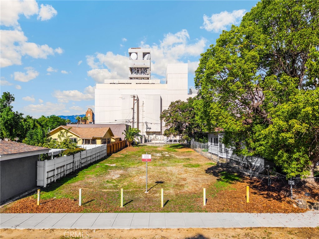 220 West C Street Ontario, CA 91762 - Photo 3 of 22 a view of a swimming pool with an outdoor space