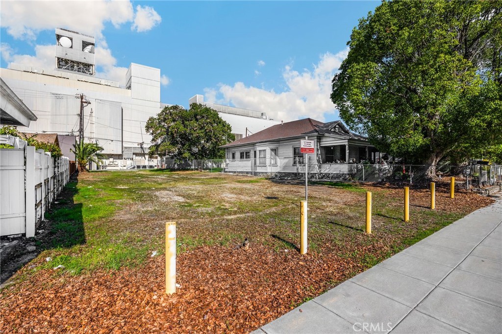 220 West C Street Ontario, CA 91762 - Photo 7 of 22 a view of a house with a yard