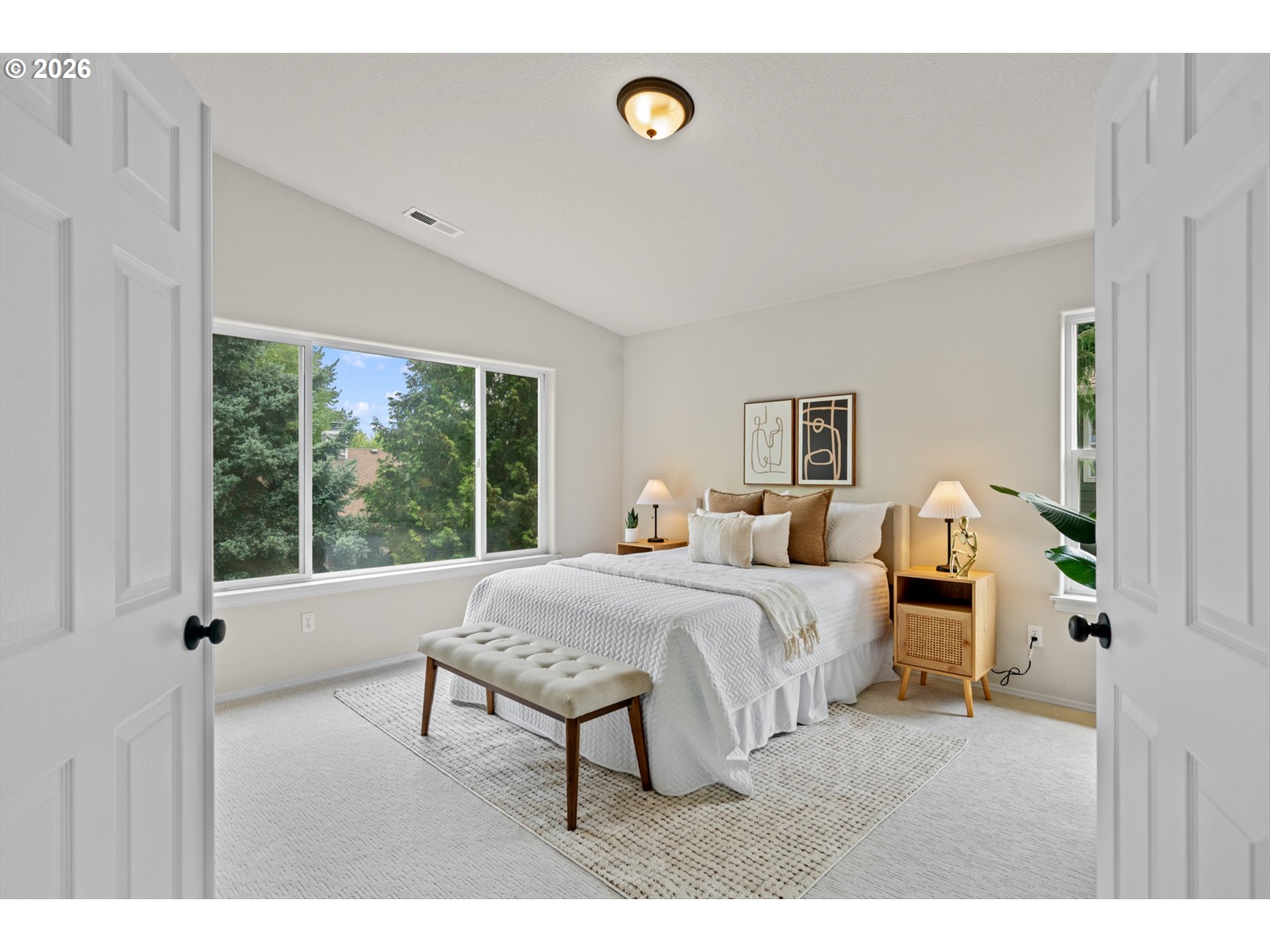 462 Southwest 211th Avenue Beaverton, OR 97006 - Photo 19 of 40 a bedroom with a bed and a large window