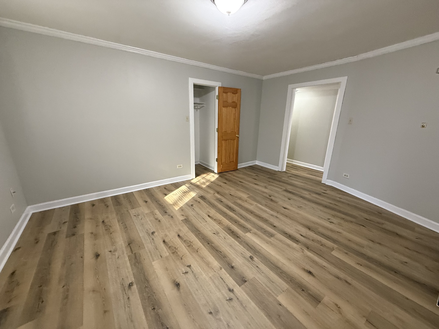 102 Lincoln Avenue, Unit GDN Riverside, IL 60546 - Photo 2 of 12 a view of an empty room with wooden floor