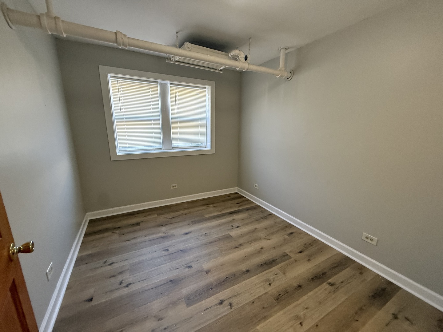 102 Lincoln Avenue, Unit GDN Riverside, IL 60546 - Photo 8 of 12 a view of a room with wooden floor and window