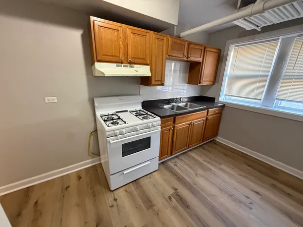 a kitchen with a stove and a microwave